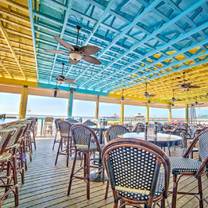 photo of sunset beach tropical grill and playmore tiki bar restaurant