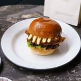 West End: “MFC” Burger with a Glass of Prosecco Photo
