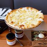 Cover image for UNA pizza + wine Calgary: University District