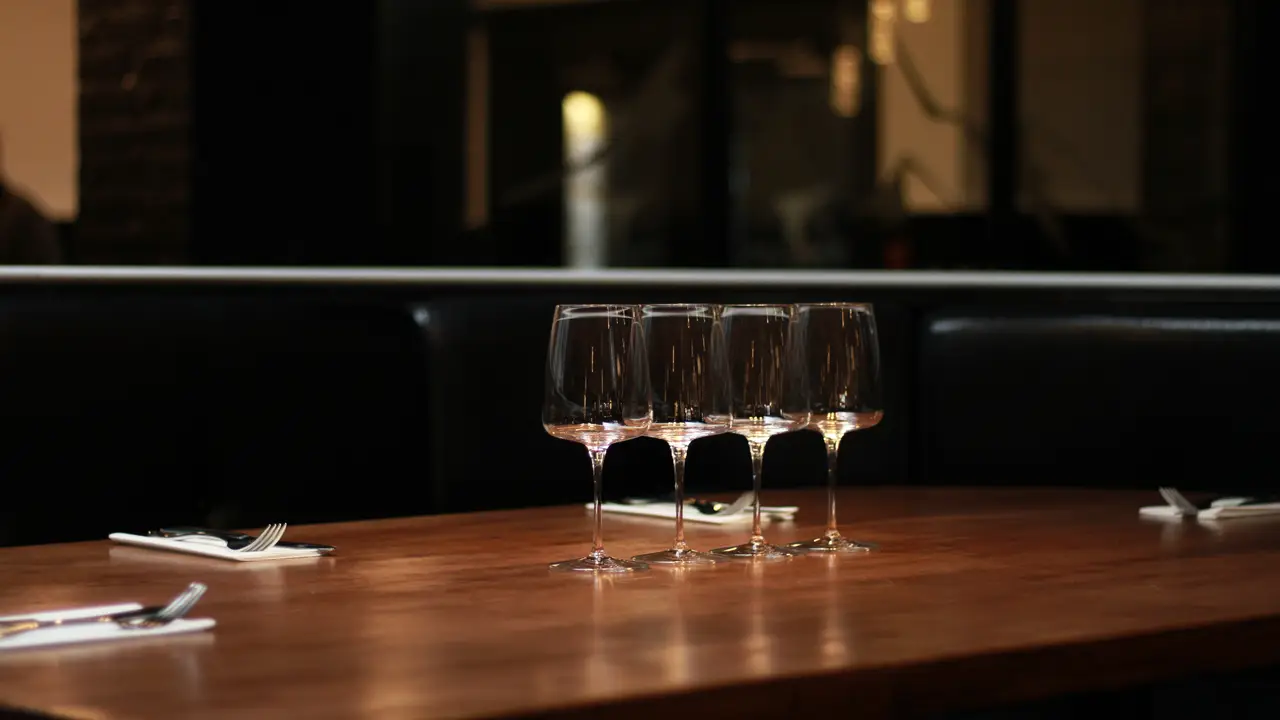 Wine glasses on table - Tomahawk Kitchen & Bar, Calgary, AB