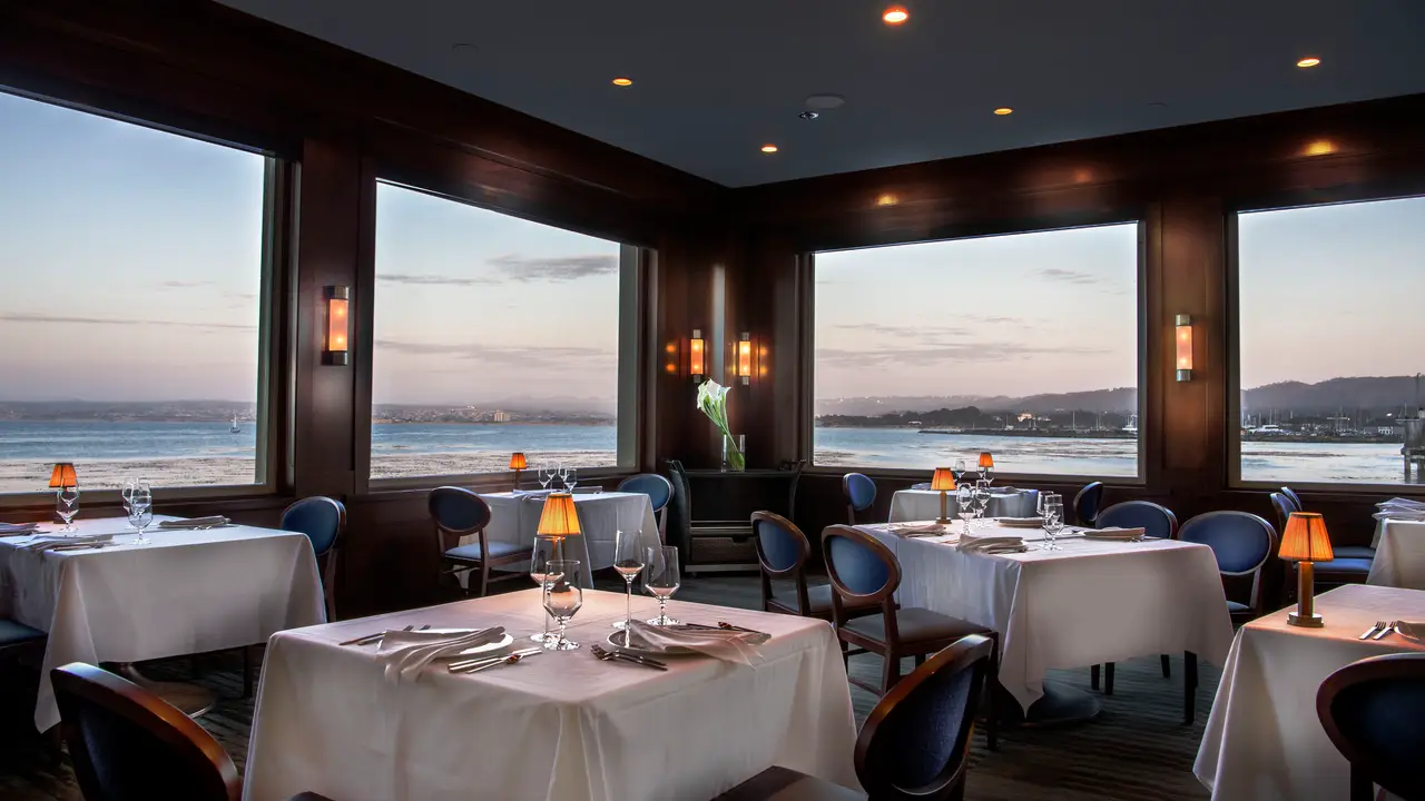 Elegant dining room suspended over the Bay - Coastal Kitchen Monterey, Monterey, CA
