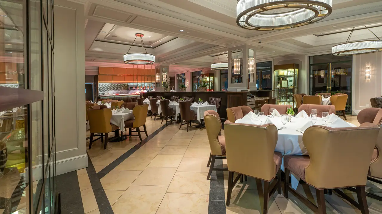 Window seat, booths, large parties, fine cuisine - Criollo at Hotel Monteleone, New Orleans, LA