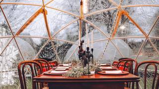 Al fresco dining in our heated garden Igloos photo