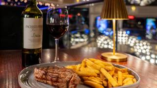 Steak and frites with a glass of malbec £19 Photo