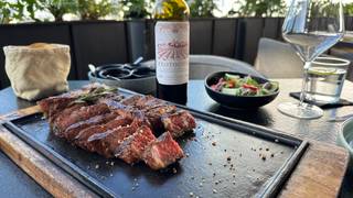 Free bottle of wine with your steak. photo