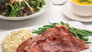 Double Smoked Triple Glazed Ham Feature $49/person photo