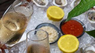 $1 OYSTER paired WITH TAITTINGER Champagne Bottle Photo