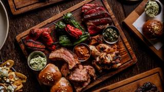 BRIX LDN sharing board with a cocktail Photo
