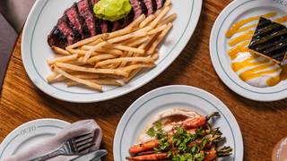 $49 Steak Menu Inc. Glass of Wine Photo