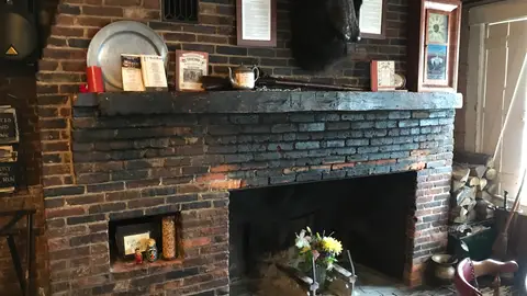 Thin brick wood stove surround looks great, feels toasty