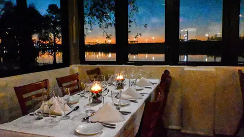 Orlando, FL USA- April 10, 2021 : A dining table and chairs at a