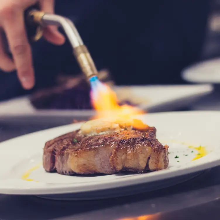 USDA Prime steak, thyme butter melting - PRHYME: Downtown Steakhouse, Tulsa, OK