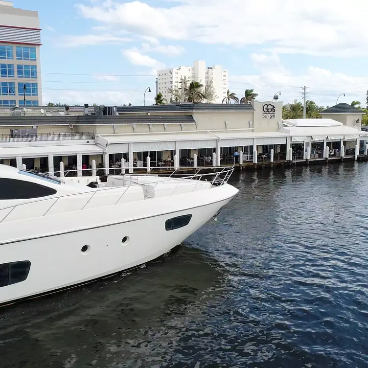 Beautiful yacht cruising by GG's Waterfront - GG's Waterfront Bar & Grill, Hollywood, FL