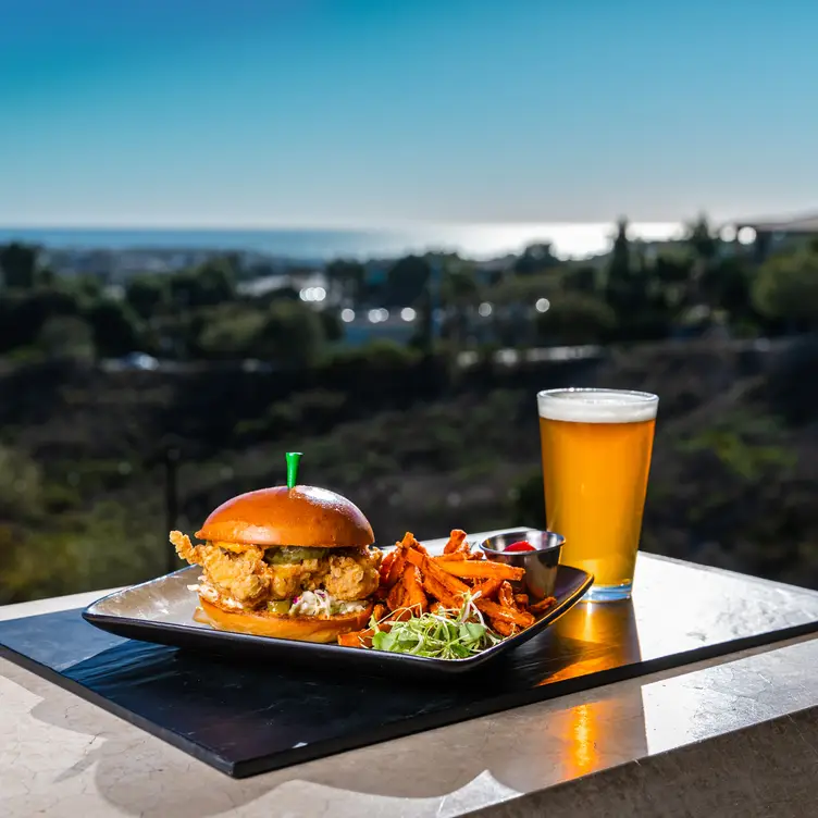 Fried chicken sandwich and beer with ocean view - Canyons at The Crossings CA Carlsbad