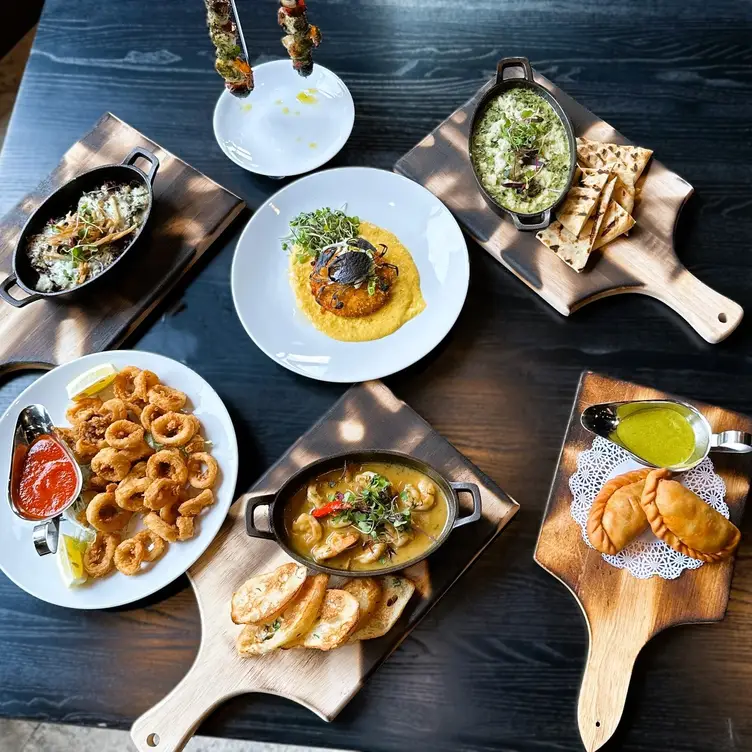 A display of an assortment of appetizers - One Pier Steakhouse NY Yonkers