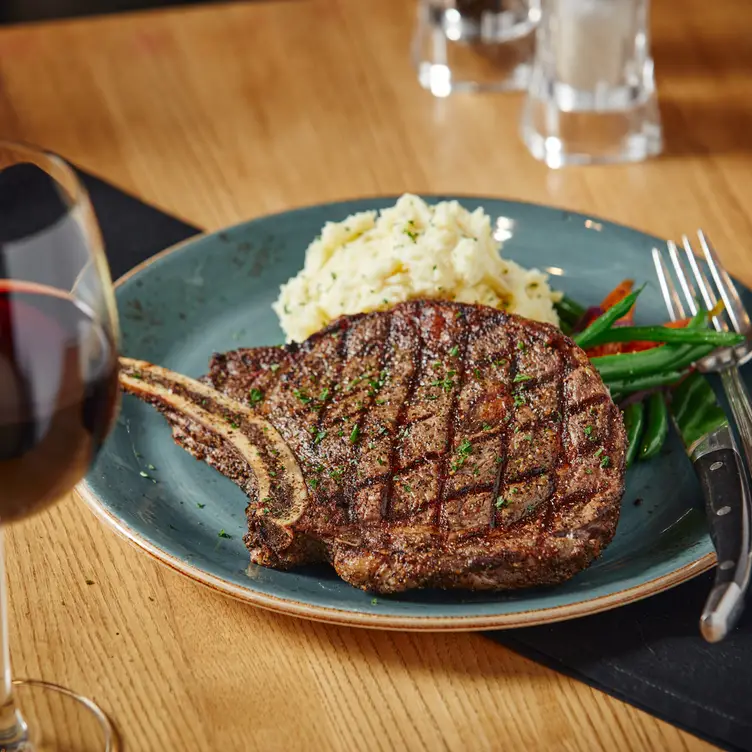 16oz Bone-In Rib Steak - Milestones Grill + Bar - Millstream BC Victoria