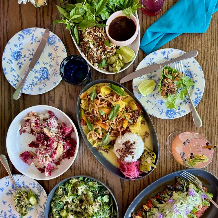 overhead shot of several plates on a table - Blossom and Root Kitchen CA Danville