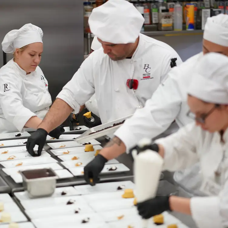 Students plating cheese cake trio dessert  - The Renegade Room Restaurant at Bakersfield College CA Bakersfield