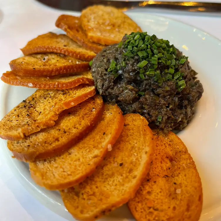 Black olive tapenade on a french baguette crouton - Azalea, New York, NY