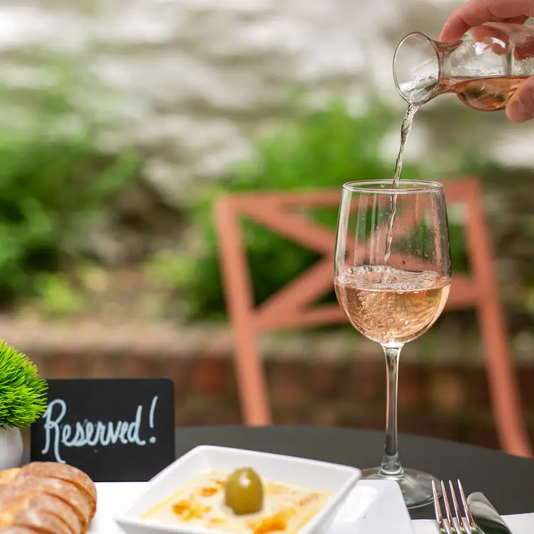 A glass of Cote de Provence rose with humus - Madame Bonté Wine Bar, New York, NY