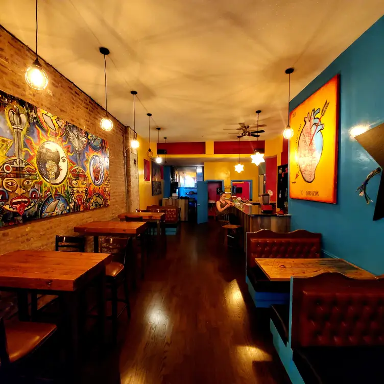 Local art adorns this eclectic Mexican eatery. - Estrella Negra IL Chicago