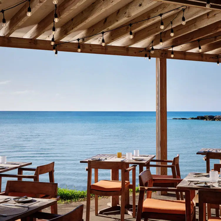 Waterfront setting with elevated island cuisine - Breezes Restaurant, Sandys, 