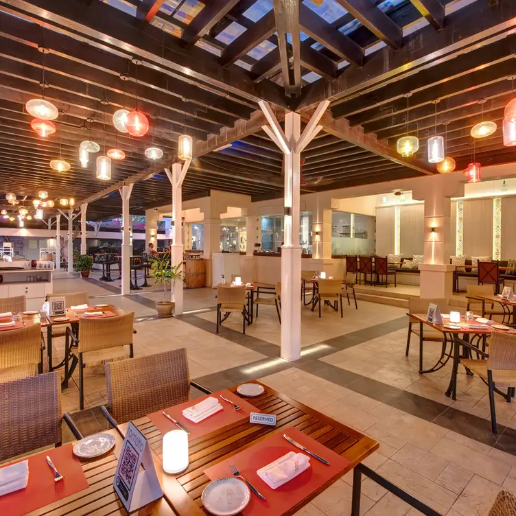 Tomato restaurant dining area with pool view. - Tomato Restaurant - InterContinental Muscat, Muscat, Muscat