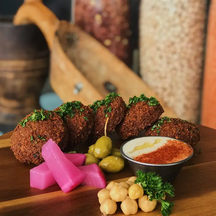 Falafels, tahini, pickled olives, and turnips. - Baladi Mediterranean Cafe, Virginia Beach, VA