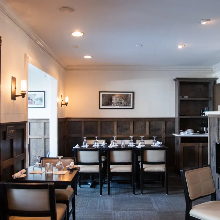 Cozy elevated dining room with leather chairs - Park Cafe, Nashville, TN