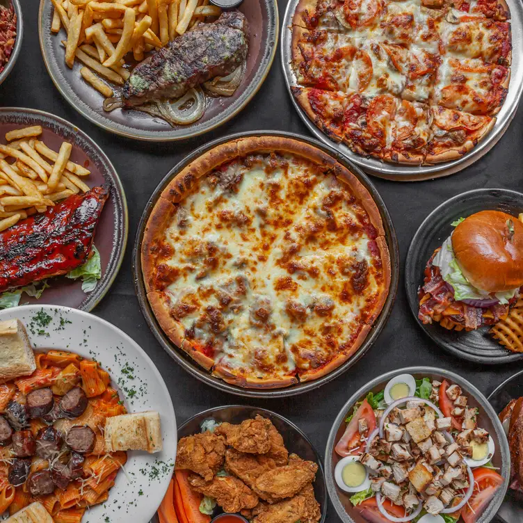 Exchequer serving deep dish pizza in Chicago - Exchequer Restaurant & Pub, Chicago, IL