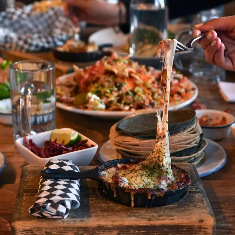 Mad Mexican Choriqueso and Signature Nachos - Mad Mexican Restaurant, Toronto, ON