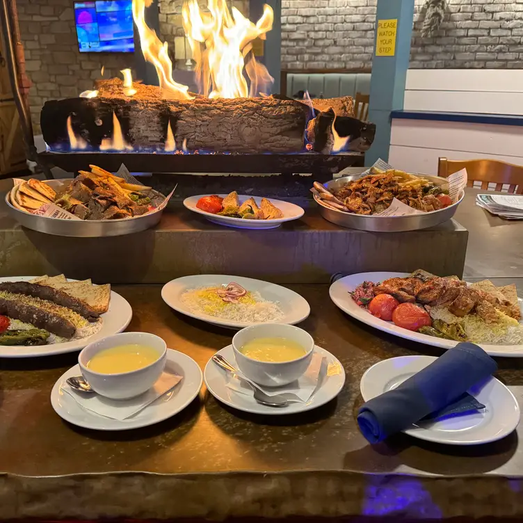Traditional Greek dishes enjoyed by a warm fire - Olive & Feta, La Grange, IL