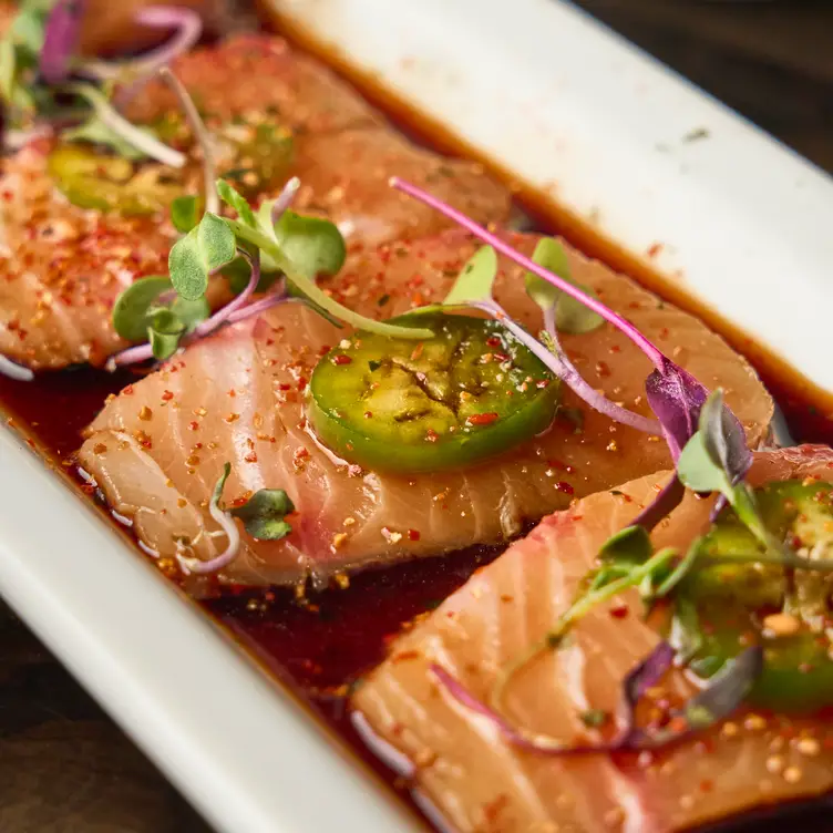 Fresh yellowtail sashimi topped with jalapeños, - Fuku Sushi, Tucson, AZ