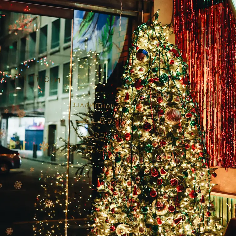 Merriest Bar entrance with decorated tree - Merriest CA San Francisco