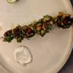 A photo of grilled lobster tail skewer of a restaurant