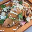 A photo of goat empanadas of a restaurant