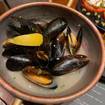Una foto de Wined mussels de un restaurante