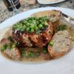 A photo of Pork Chop Vesuvio of a restaurant