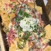 Una foto de Steel Pan Nachos de un restaurante