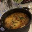 A photo of French onion soup gratinée of a restaurant