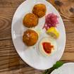 A photo of Arancini con baccala' of a restaurant