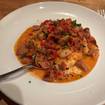 レストランのWood-Grilled Shrimp And Grits​の写真