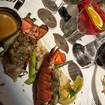 Een foto van Blue Crab Stuffed Lobster Tails van een restaurant 