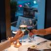 A photo of Grapes and Guitars at The Conrad Hotel! of a restaurant