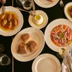 A photo of 4 course $85 set menu for large groups of a restaurant