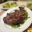 Una foto de Monday Steak Night Special - To Go + at the Bar de un restaurante