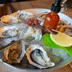 Una foto de Sip, Shuck, & Snack Happy Hour de un restaurante