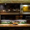 A photo of Omakase or Sushi selection at the sushi counter of a restaurant