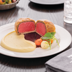 Una foto de Beef Wellington de un restaurante