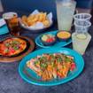 A photo of Now Serving Happy Hour! of a restaurant